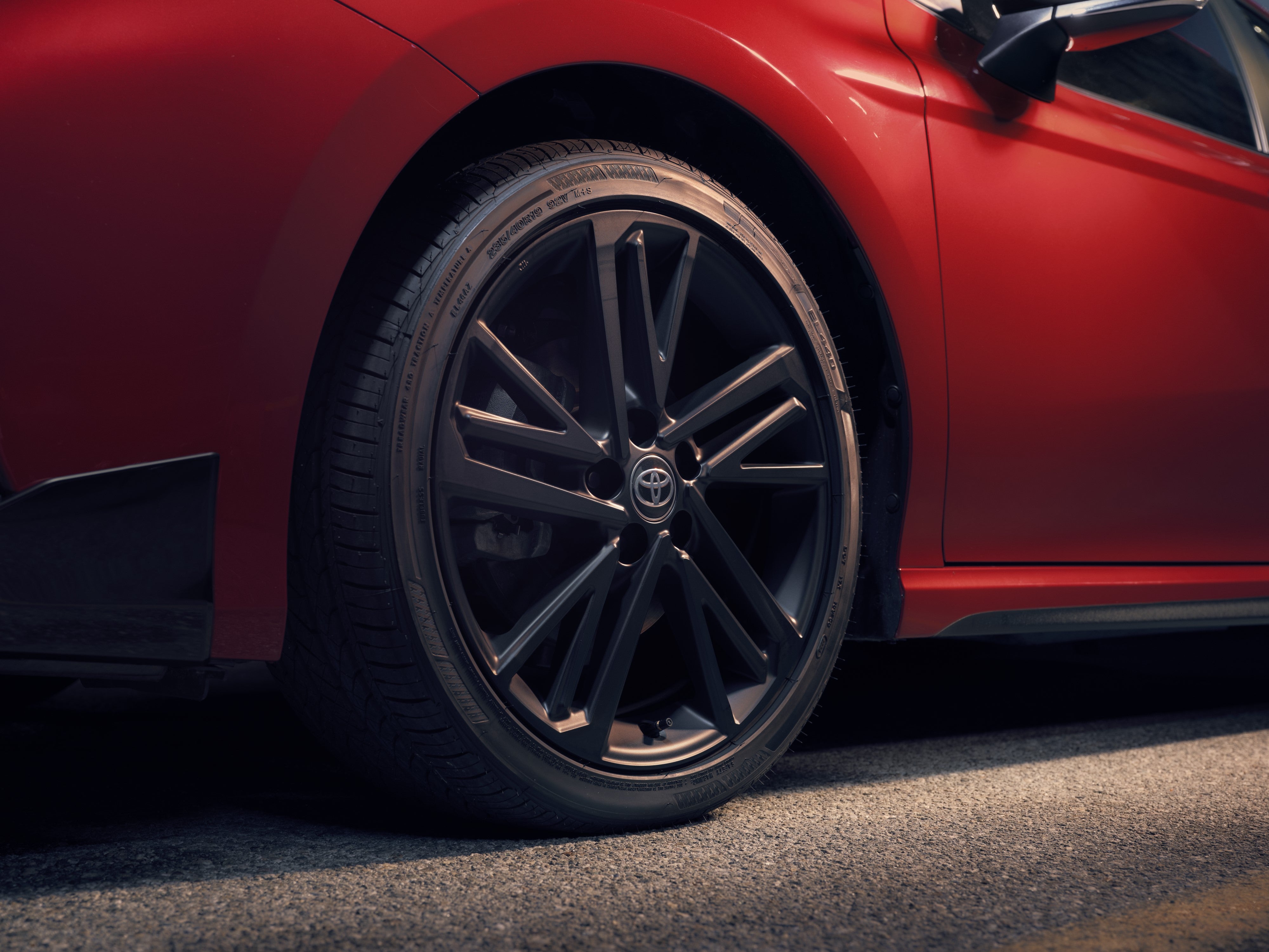 2027 Toyota Camry Nightshade with 19-inch black wheels and gloss-black grille accents