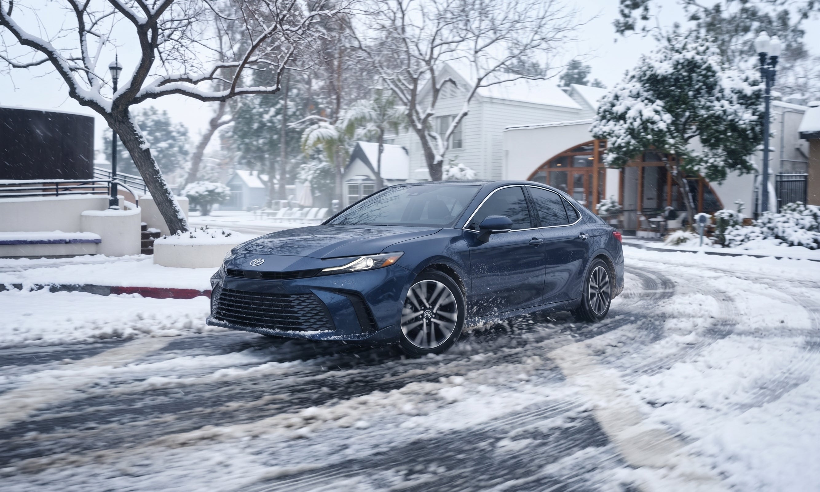 2027 Toyota Camry Driving on a Snowy Road